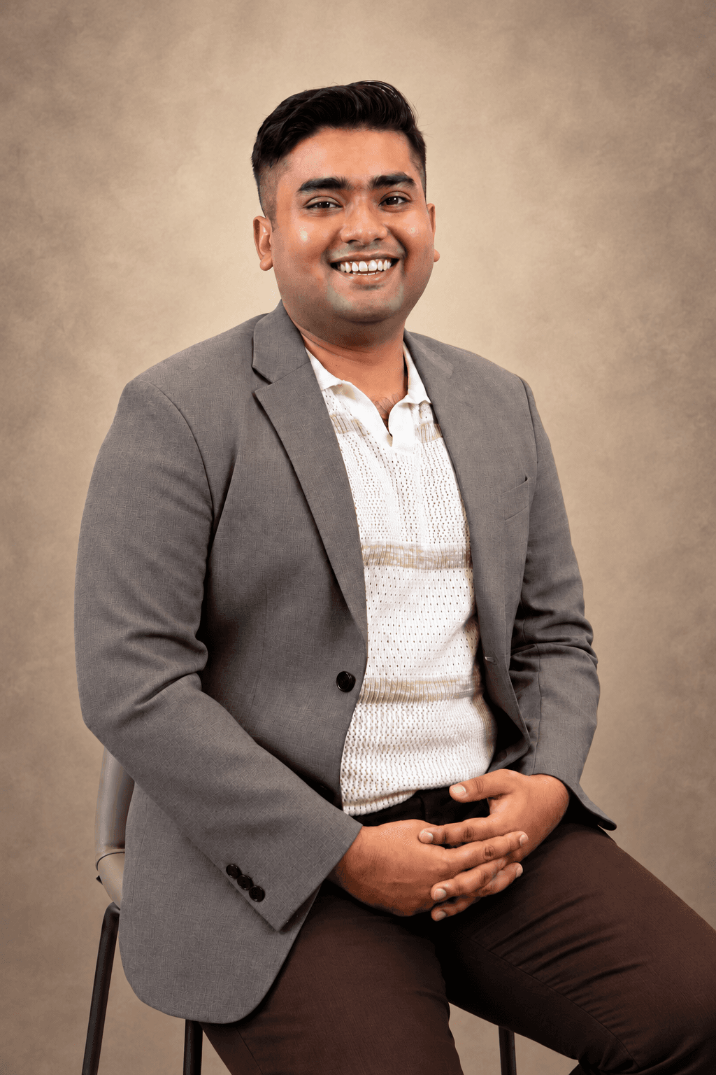 Ashwin Dinesh, seated for a portrait